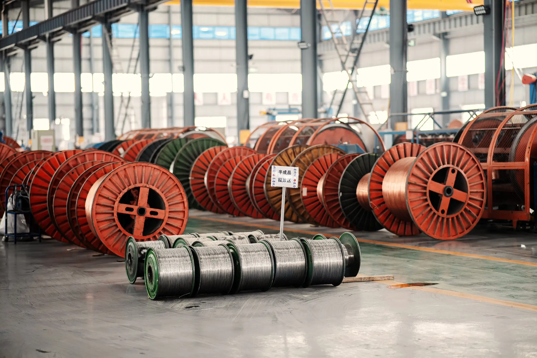 Semi-finished cable drums stacked in the transfer bay